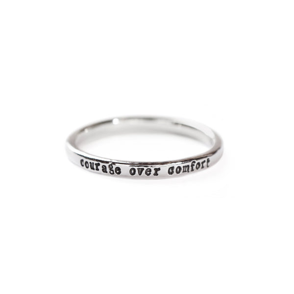 ring that says courage over comfort